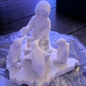 Charming Child and Penguins Porcelain Figurine